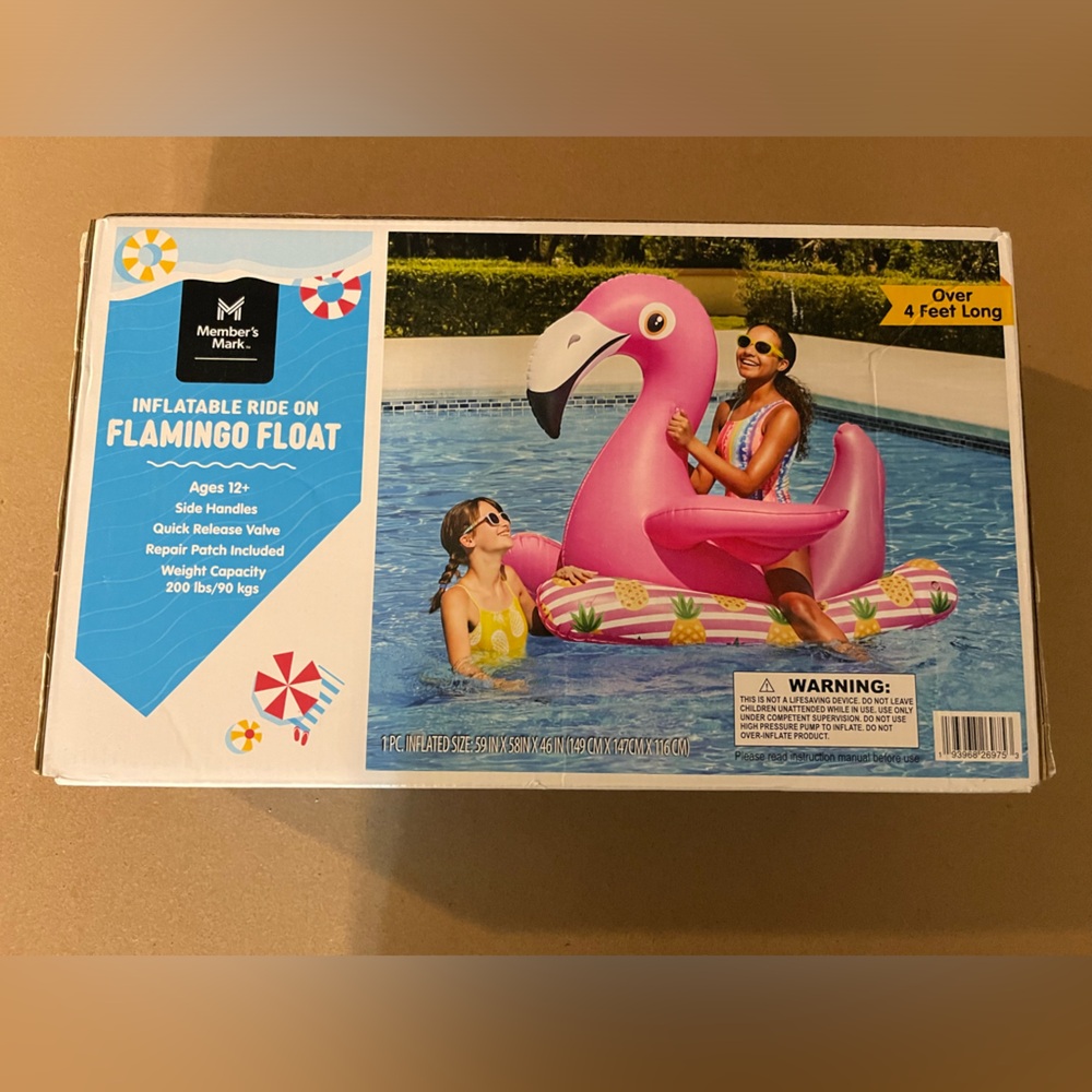 Members mark giant flamingo ride on float.